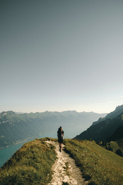 A path with a person walking on it on an adventure to illustrate new beginnings