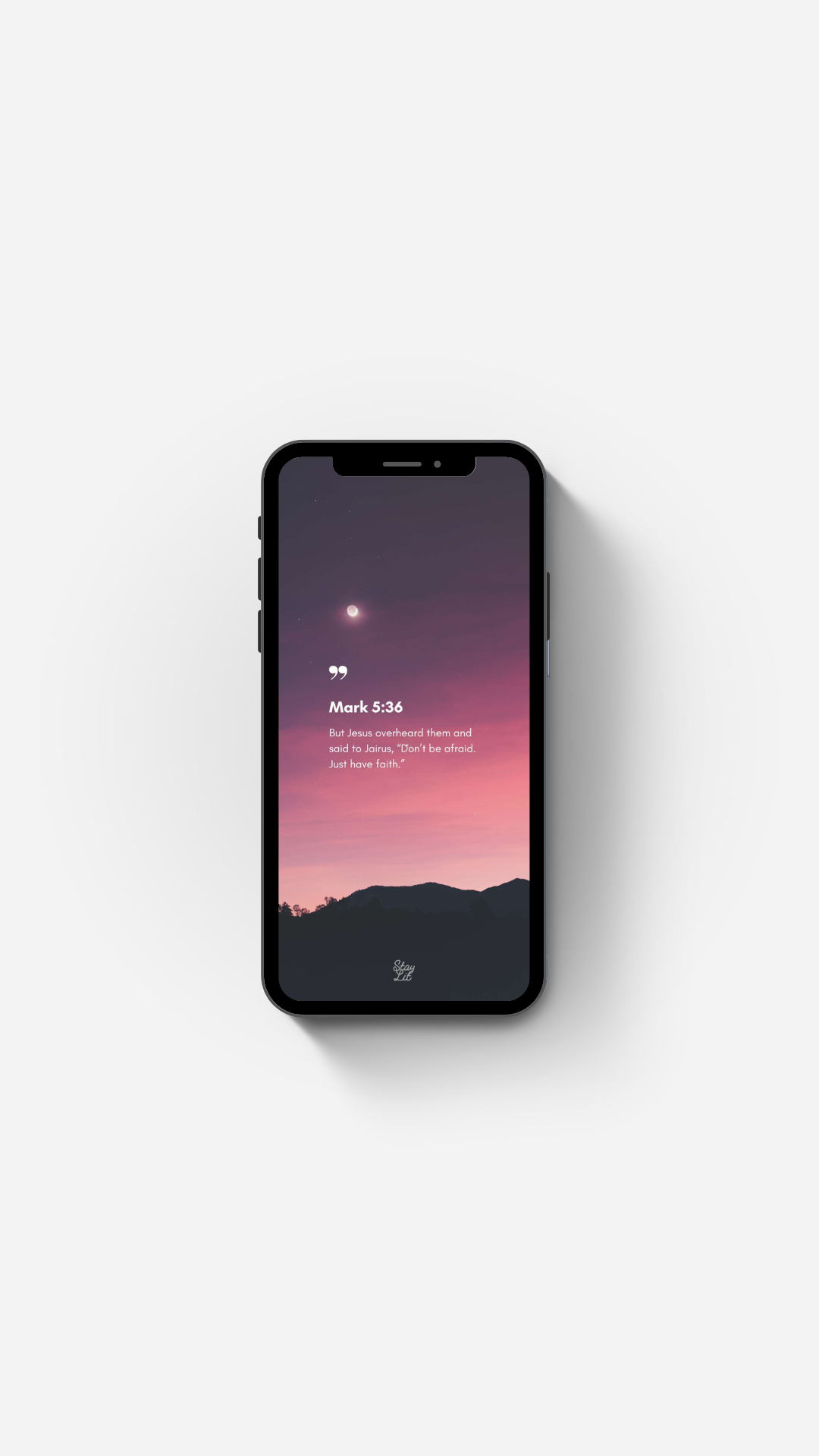 Smartphone displaying a sunset landscape on a white background Bible Verse Wallpaper by Stay Lit Apparel