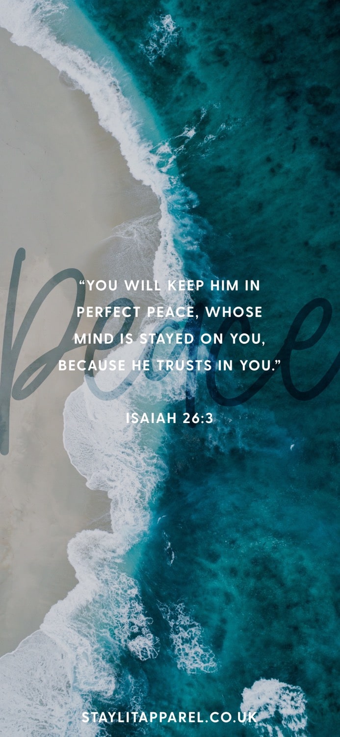 Textual quote from Isaiah 26:3 on a background of blue ocean waves and sandy beach.