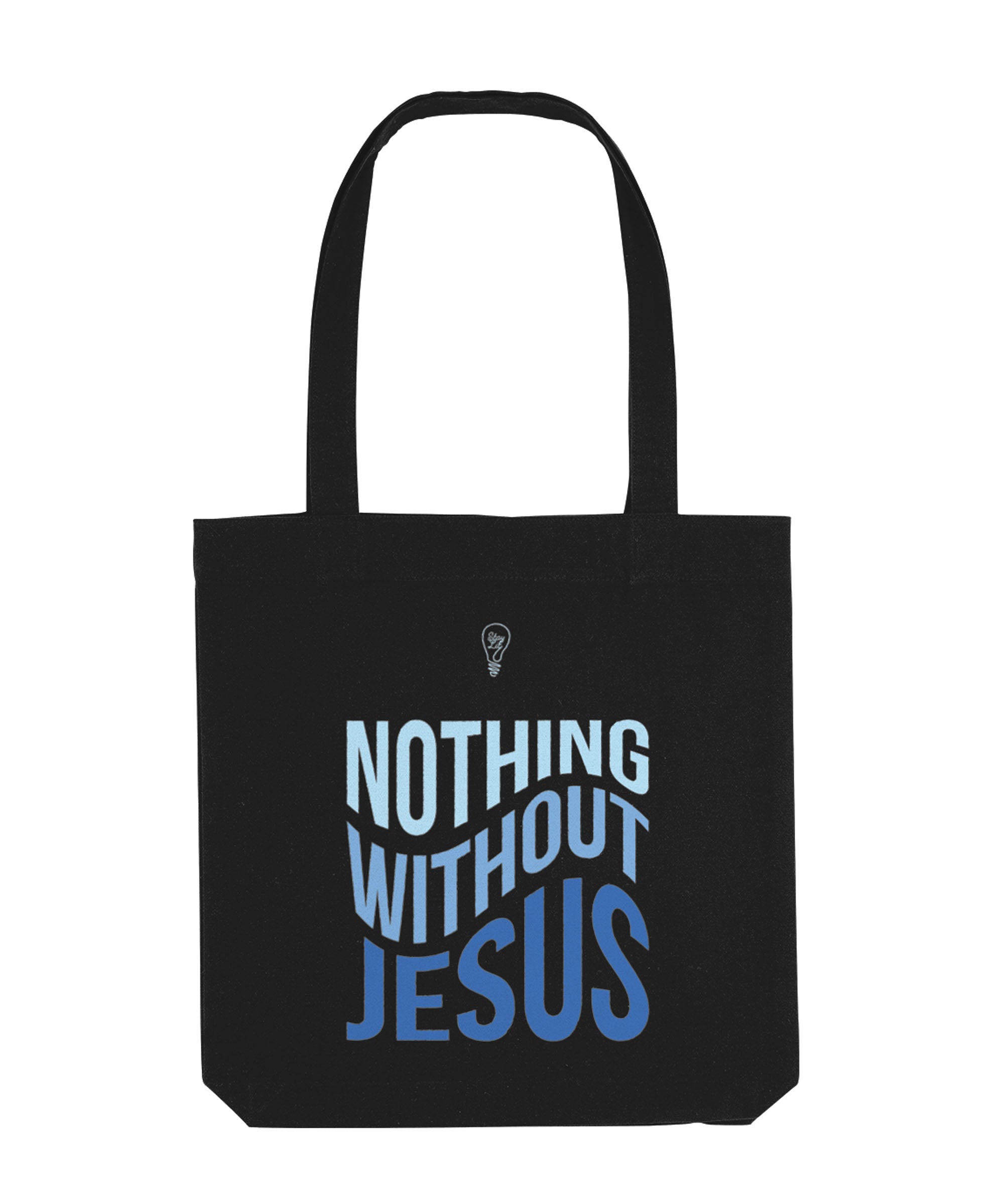 Black tote bag with 'Nothing Without Jesus' text on a white background