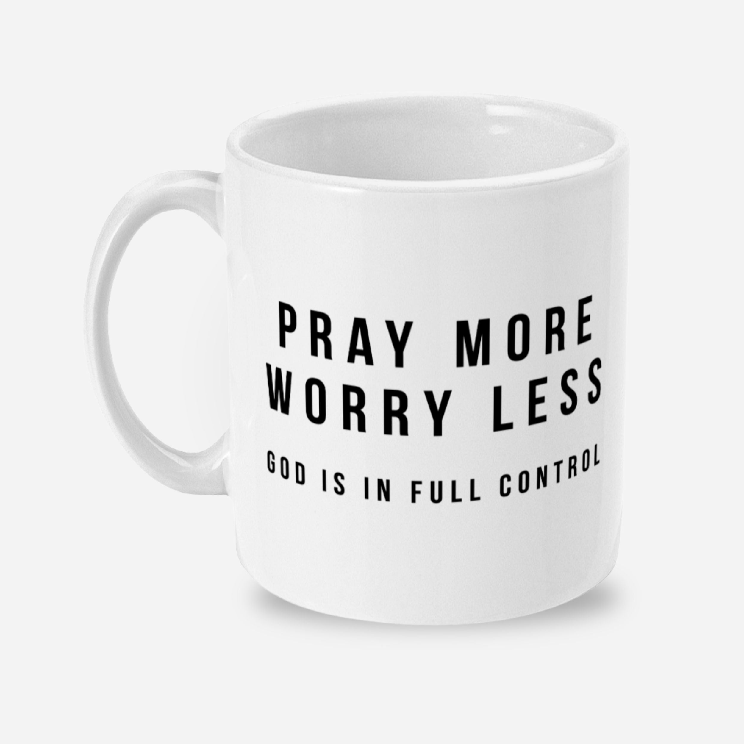 White mug with text 'PRAY MORE WORRY LESS GOD IS IN FULL CONTROL' on a white background